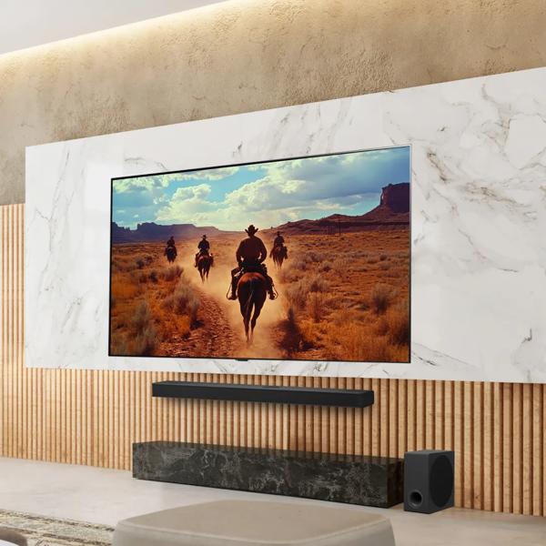 An LG TV in a stylish living room displays a scene from a Western. 
