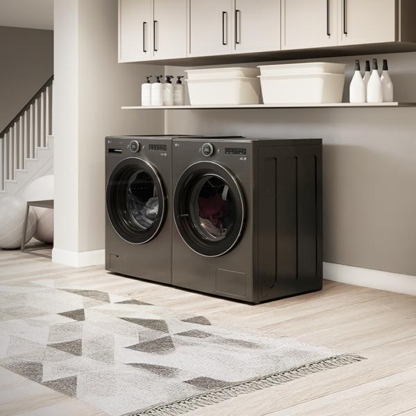 A mother and daughter unload laundry from an LG all-in-one washer and heat pump dryer.