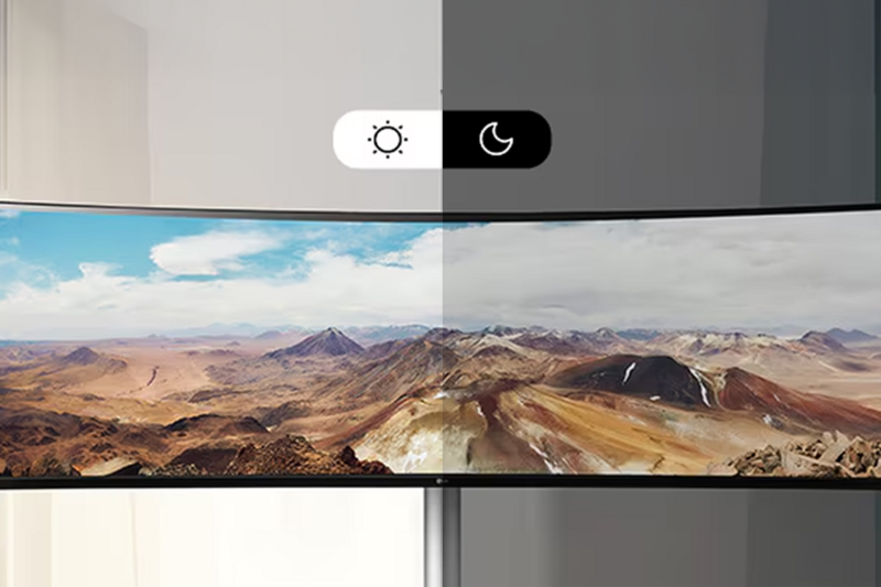 Curved screen displaying a landscape with day-night mode slider above.