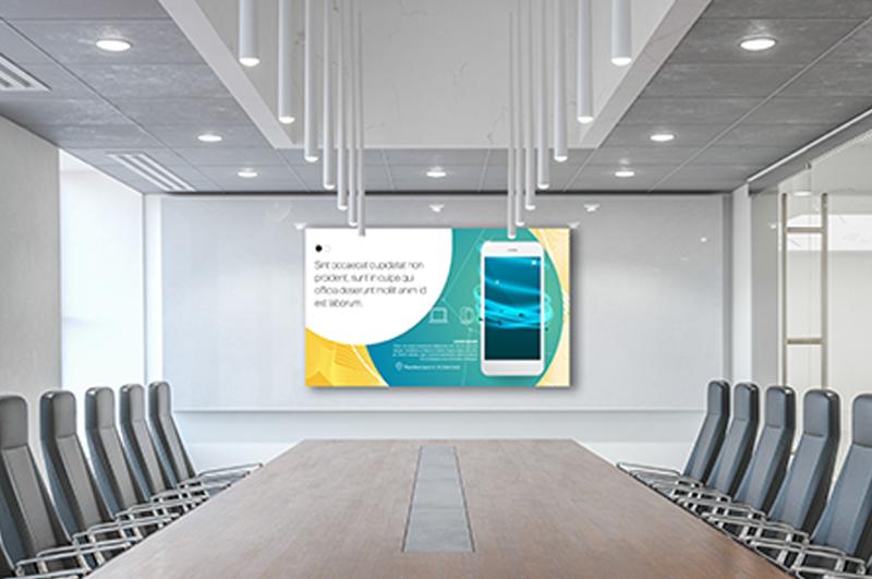 A modern conference room with a large wooden table, twelve black chairs, city views from large windows, and a digital screen displaying a presentation.