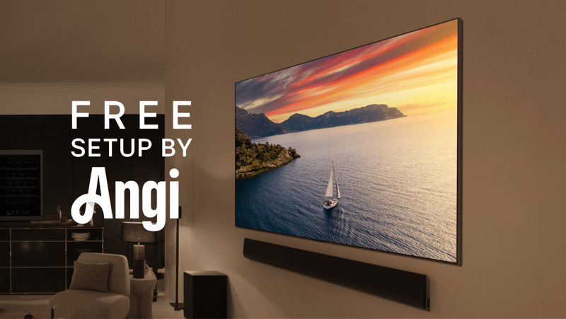 An LG TV and soundbar mounted on a living room wall as the TV displays a vivid nature scene. “Free setup by Angi” text.