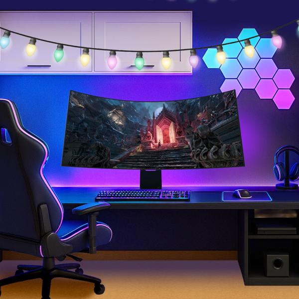 An LG curved gaming monitor shows a video game on the screen and is set up in a room for a gamer.