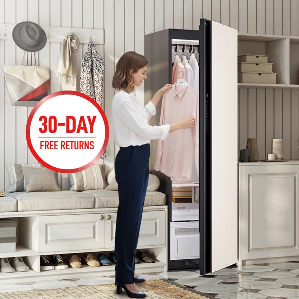 LG Styler® Steam Closet appears in bright living room setting as woman removes a freshly steamed blouse. “30-Day Free Returns” badge.