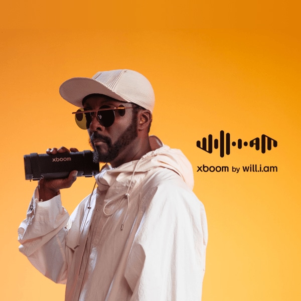 Artist will.i.am holds xboom speaker on a yellow background. “xboom by will.i.am” title badge.