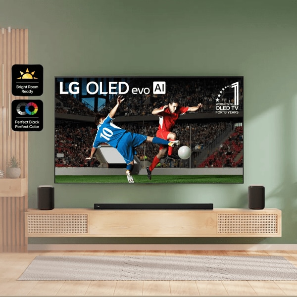 OLED TV in stylish living room setting displays soccer match. “Bright Room Ready”, “Perfect Black Perfect Color” and “Reflection Free Premium” badges.