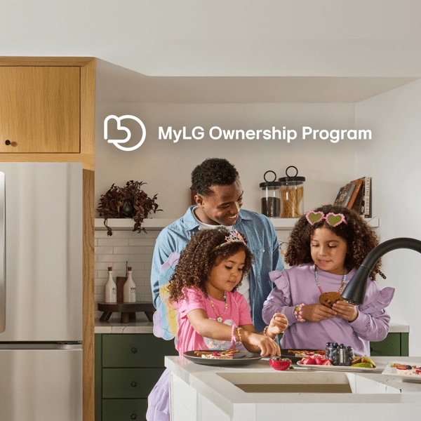 Father and daughters prepare breakfast in stylish kitchen setting.