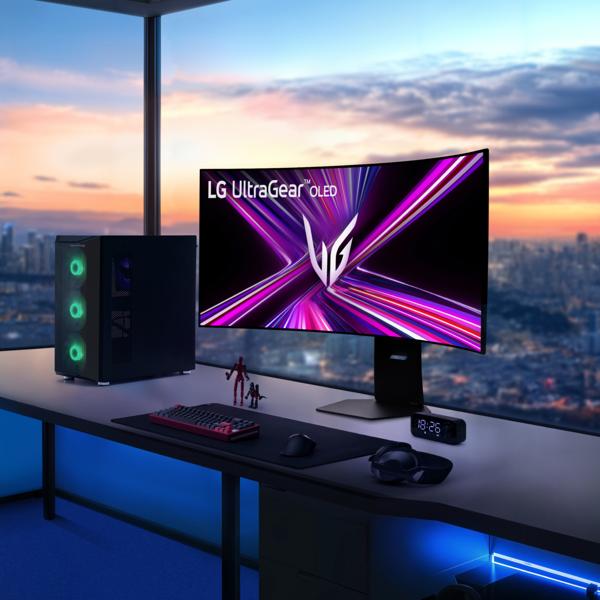 UltraGear Monitor on a desk against dusk city backdrop.
