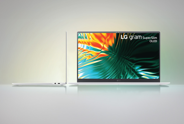 Two of 15-inch light-color LG gram SuperSlim OLED opened displaying, one side ways to show how slim it is and one facing forward. 