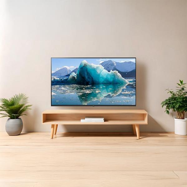 The LG 55 inch Class UHD AI TV mounted on the wall of a modern living room and an LG soundbar placed below it.