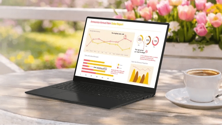 An LG gram Laptop sits open on a white outdoor café table beside a cup of coffee, displaying a colorful analytics dashboard with charts and graphs. Pink tulips bloom in the background, creating a bright spring setting.