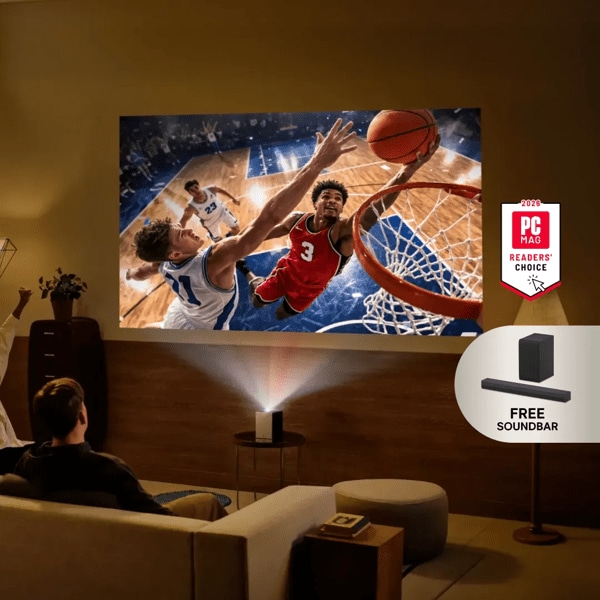 A group of friends watch a basketball screen with an LG projector from a living room. “Free Soundbar” pop-out text. “2026 PC MAG Readers’ Choice” badge.