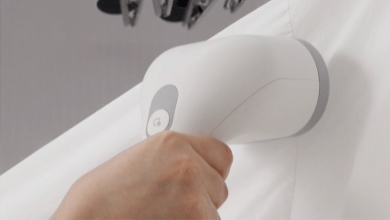 Closeup image of  LG Styler® Steam Closet built-in HandySteamer.