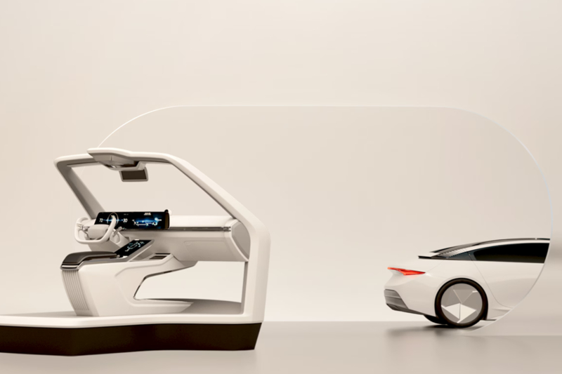 Futuristic vehicle interior design beside the rear of a modern car.
