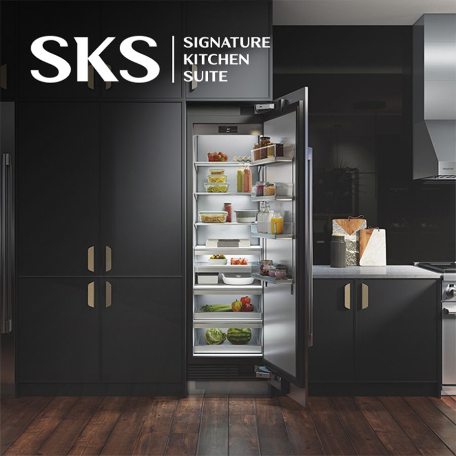 SKS Signature Kitchen Suite - luxury kitchen with an open door refrigerator full of food. 