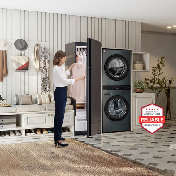 A woman removes a fresh blouse from her Styler® Steam Closet, situated beside an LG WashTower in a stylish laundry room setting. “America’s Most Reliable Line of Home Appliances” badge.