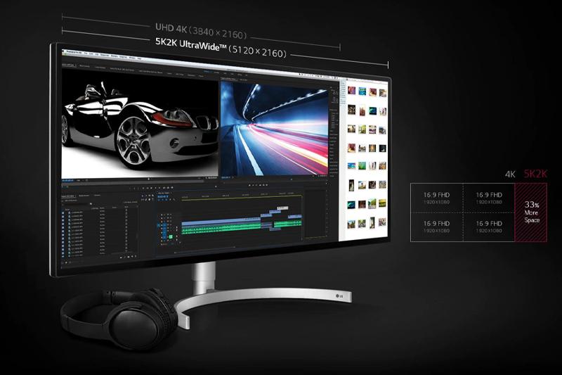 A widescreen monitor showing a video editing interface with media and resolution comparisons.
