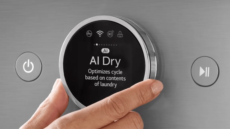 Closeup of a hand adjusting appliance dial to “AI Dry”.