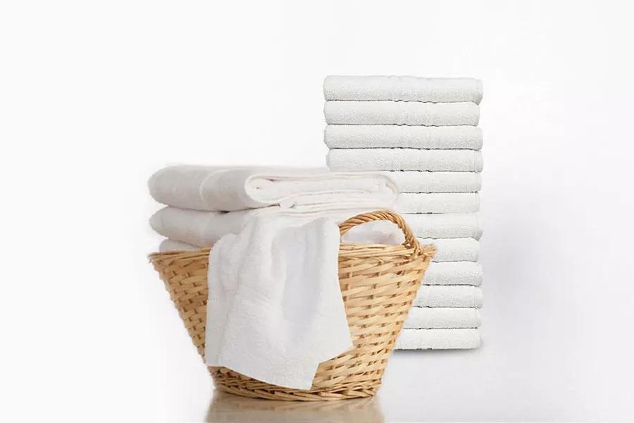 Get It All Done In Less Time - Basket of clean white towels