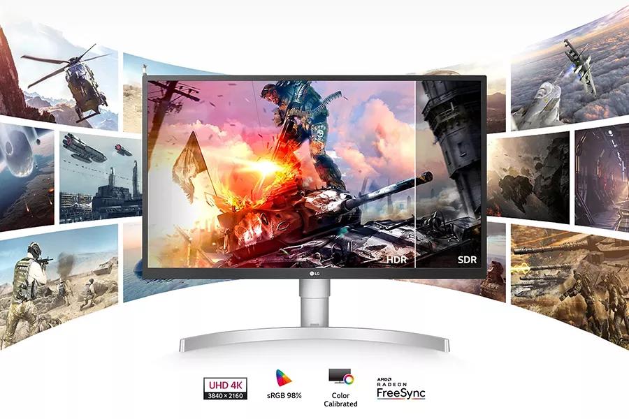 LG monitor display with video game graphics and multi panel screens behind it