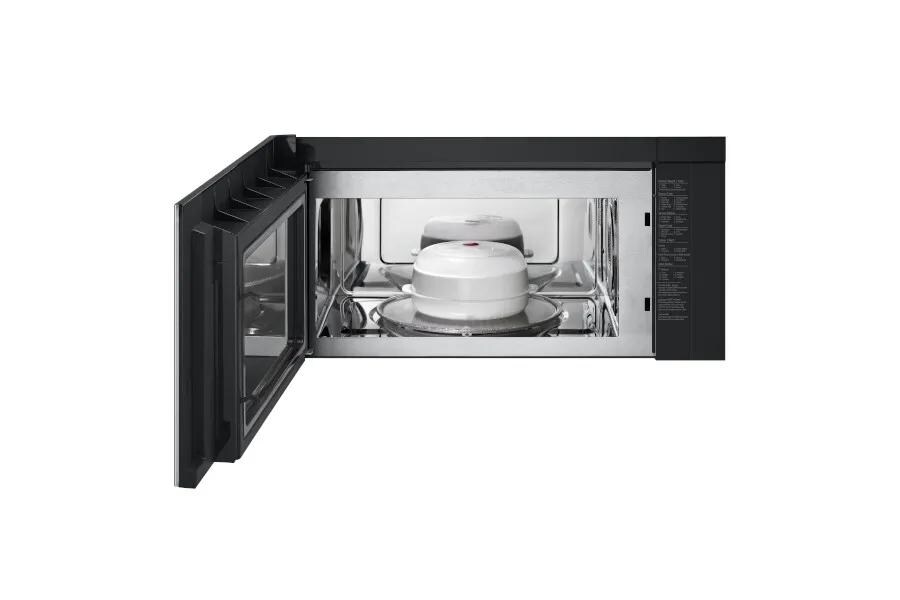 MHEU1738X Over-the-Range Microwave with door open showing white covered dish on turntable inside stainless steel interior