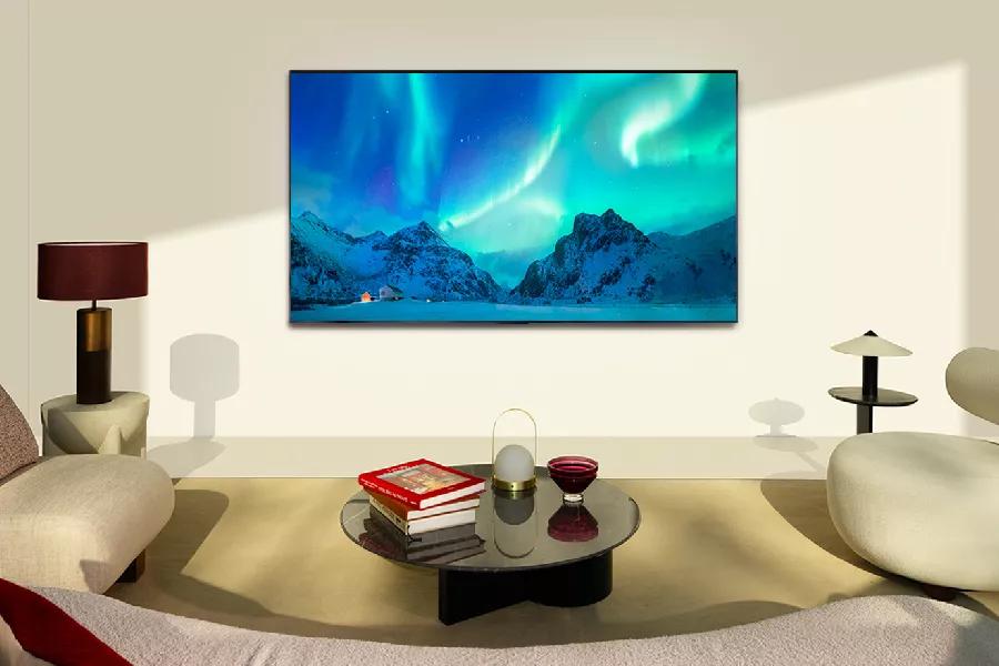 A TV in the living room shows the Northern Lights on-screen.