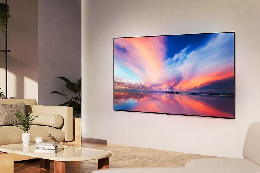 The LG OLED B4 seamlessly wall mounted in a sunny living room. 