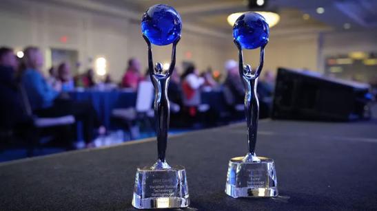 Two silver trophies with blue globes on a stage, audience blurred in the background

Transcribed Text:

"2024 DARM Vacation Rental Technology Catskills Region Best Innovation Award"