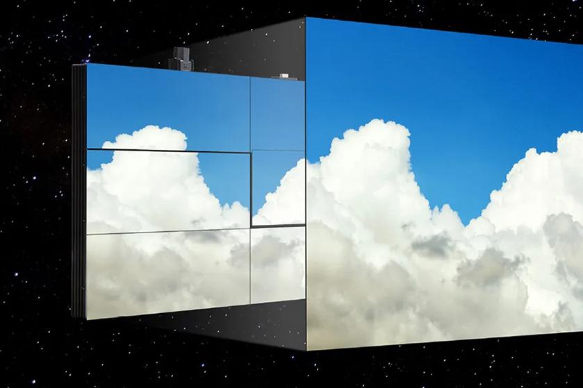 A digital display of nine panels showing white clouds in a blue sky, set against a starry background.