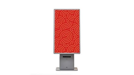LG touch kiosk with a red and gold pattern on its display