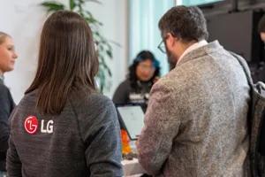 LG employees check guests in at an event