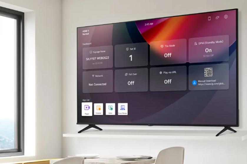 A flat-screen TV on a wall displaying a settings dashboard in a bright room.