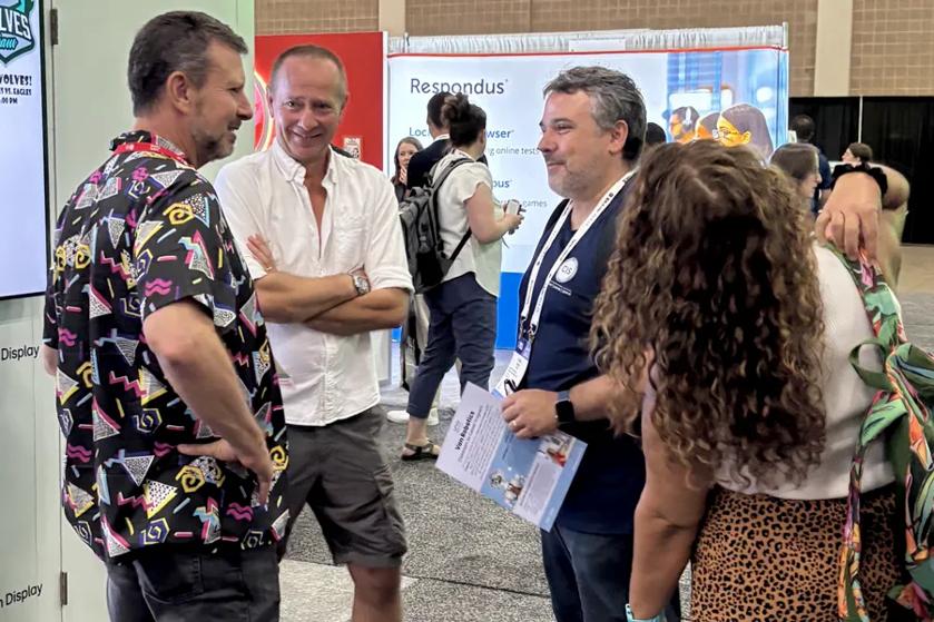 Event attendees smile and talk