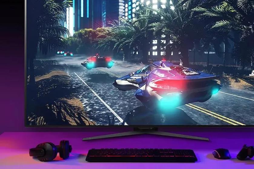 Futuristic flying vehicles displayed on a UltraGear Monitor with computer peripherals in front.