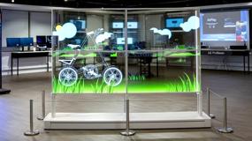 The Transparent OLED display in the Chicago BIC, with digital signage and IT solutions visible in the background through the transparent display.