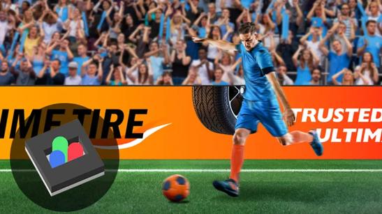 A soccer player kicks the ball. In the background is a cheering crowd and LG Stadium Series DVLED. In the bottom left corner is an illustration of a Dots In Place type DVLED pixel. 