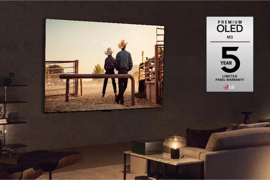 A western plays on the TV. Premium OLED M3 5 year limited warranty logo.