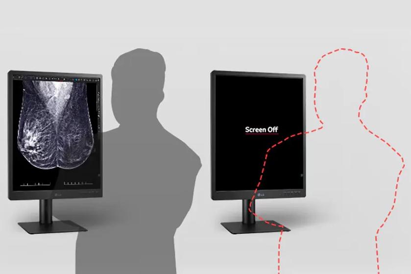 The image displays two LG diagnostic monitors side by side against a light gray background. The monitor on the left shows a high-contrast black-and-white mammogram image with detailed textures and visible patterns typical of medical imaging. In front of this monitor is a dark gray silhouette of a person, suggesting someone viewing the screen. The monitor on the right displays a black screen with the text "Screen Off" in white. In front of this monitor is a red dashed outline of a person, indicating their position as if the person is invisible. Both monitors are mounted on rectangular stands.