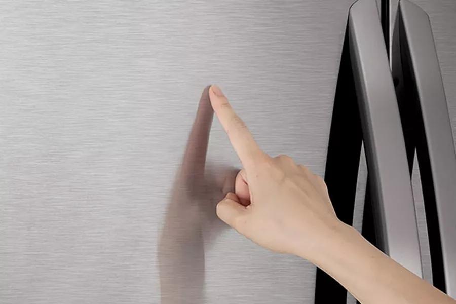 Hand touching refrigerator PrintProof finish