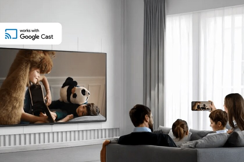 A family watching TV, which mirrors a smartphone screen, in a modern living room with natural light.

Transcribed Text:

works with Google Cast.