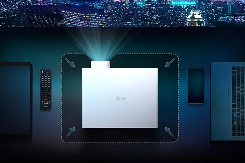 LG projector emitting light, surrounded by a tablet, remote, smartphone, and laptop on a dark surface with a city skyline background.