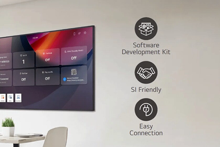 Wall-mounted display showing a user interface with text and icons beside it.

Transcribed Text:
Software Development Kit
SI Friendly
Easy Connection