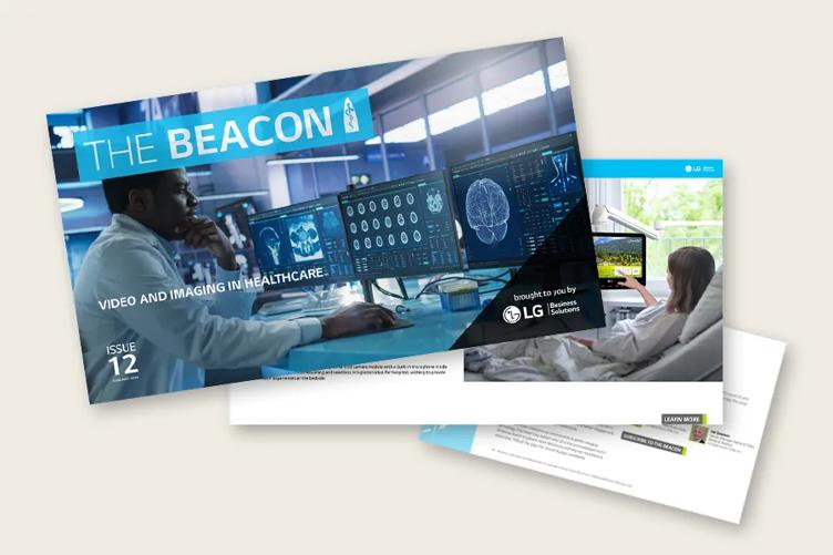 Three pages from The Beacon newsletter overlapping on each other: The cover is on top, showing a doctor using several medical monitors with The Beacon logo above him and Issue 12 at the bottom of the page. Beneath the cover, hints of other photographs and article text are visible on the other two pages.