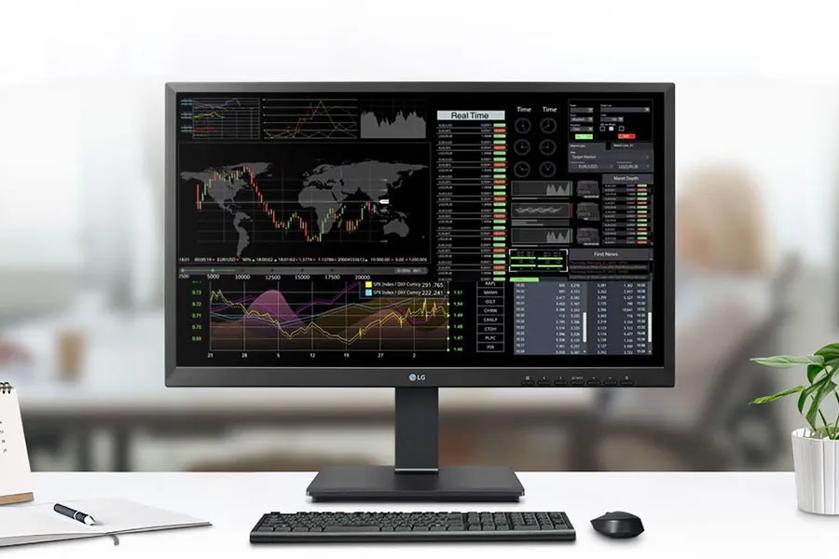 A busy office in the background, with an LG all-in-one cloud client in the foreground.