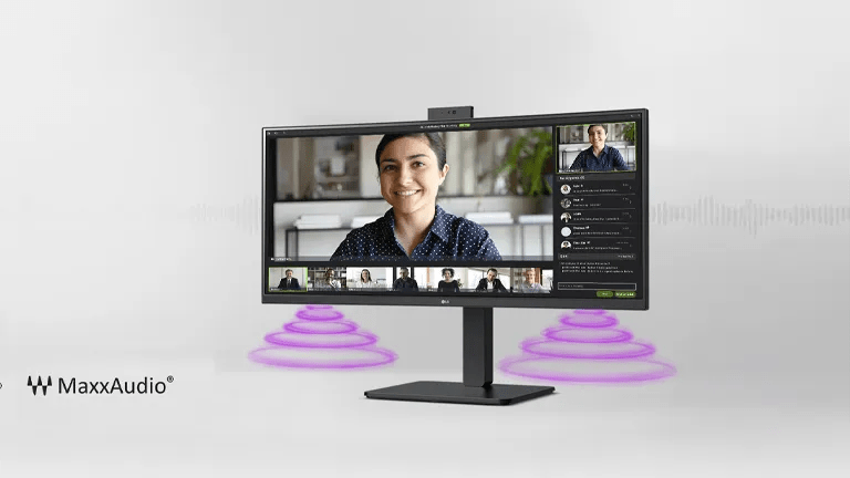 Monitor displaying a video call with MaxxAudio sound waves and logo.