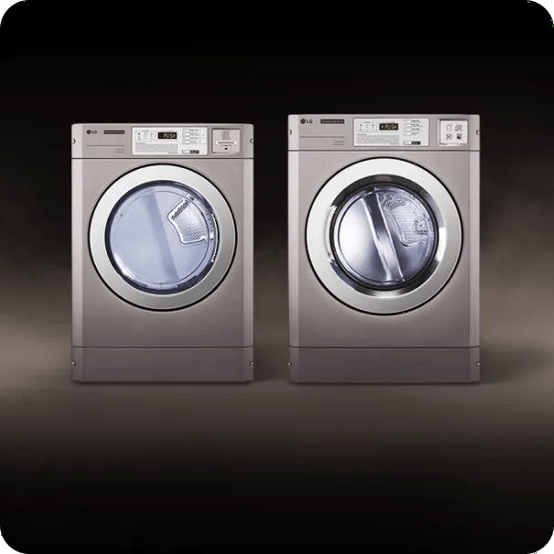 Two LG commercial front-load laundry machines side by side against a dark background.