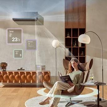 Woman relaxing in a smart living room while LG AI Air conditioner automatically adjusts temperature, airflow, and humidity.