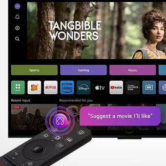 On an LG OLED TV screen is the webOS 25 home page filled with apps and entertainment content. By the TV is the LG AI Magic Remote, the AI button is highlighted as if activated by the user's voice. A speech bubble is beside it, 'suggest a movie I'll like'