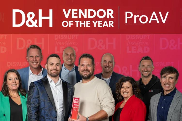 LG employees smile at the camera. The man in the center holds the D&H Vendor of the Year award. Text above reads D&H Vendor of the Year Award, Pro AV.