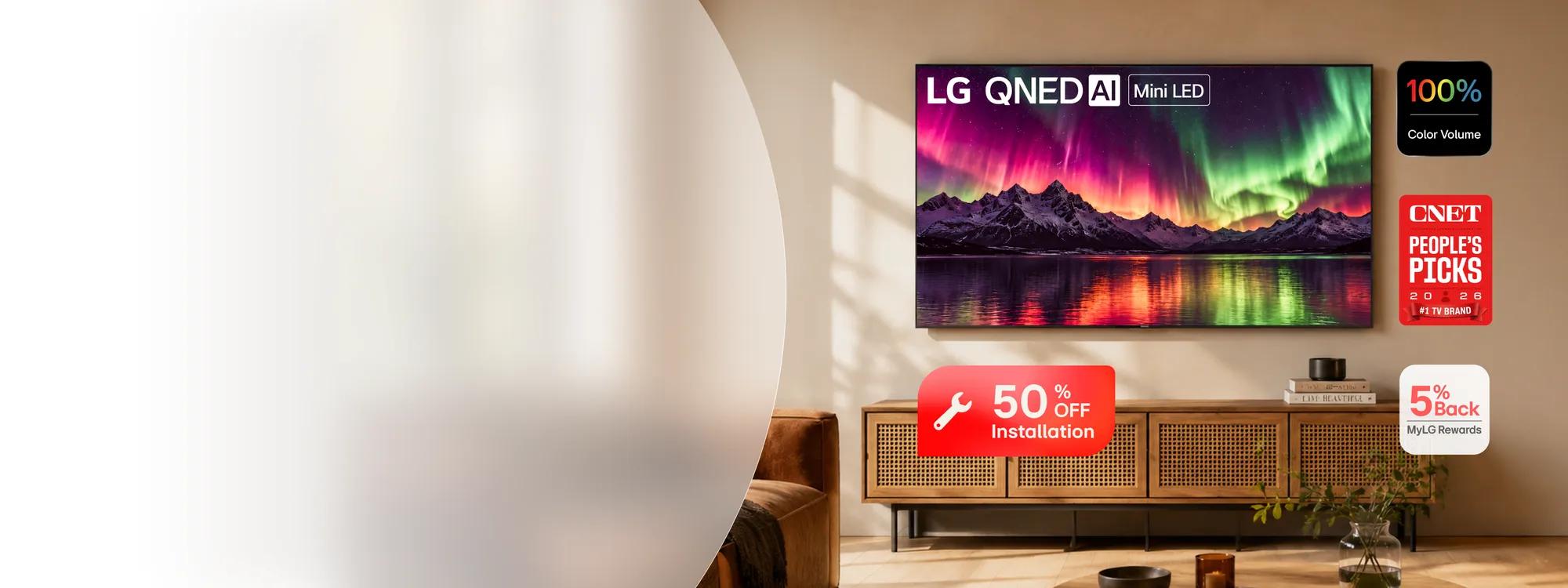 LG QNED AI Mini LED TV wall-mounted in a living room displaying aurora borealis, with a media console below. 100% Color Volume badge visible. CNET People's Picks 2025 #1 TV Brand badge visible. 50% OFF Installation offer. 5% Back MyLG Rewards badge visible.