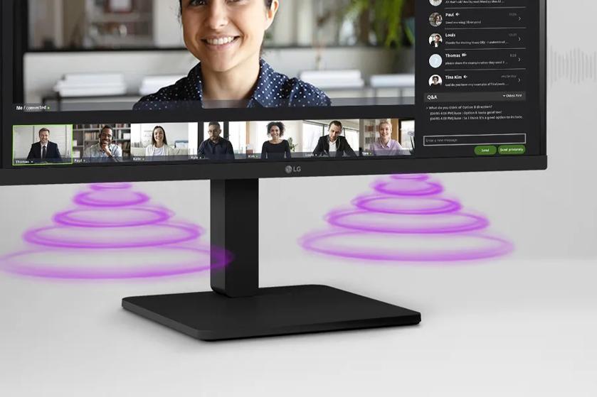 Computer monitor displaying a video conference with visible sound wave graphics.